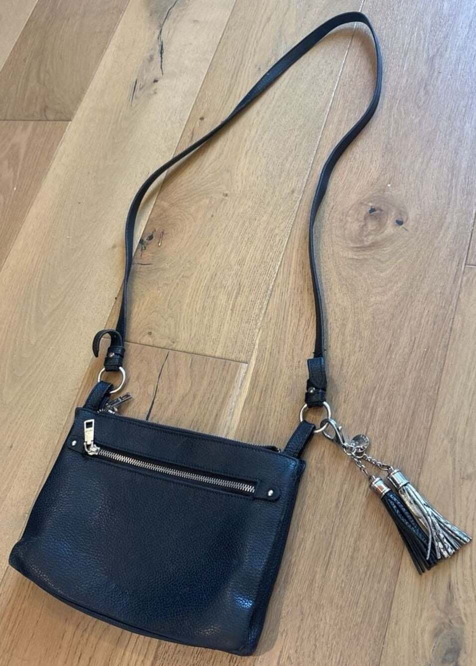 PRÜNE Black Bovine Leather Crossbody Bag with Tassel Charms